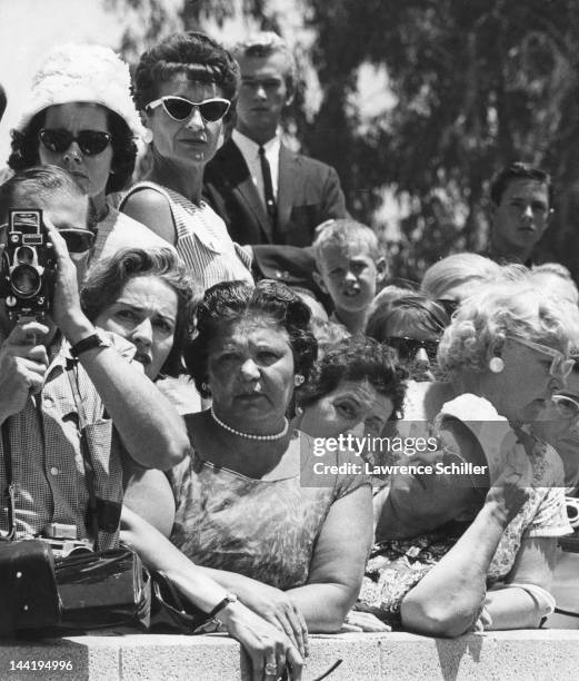 Fans and onlookers gather outside the Westwood Village Memorial Park Cemetery for the internment of recently deceased American actress Marilyn...