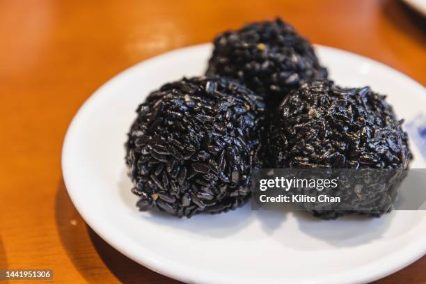 chinese snack sticky black rice ball - black rice stock pictures, royalty-free photos & images