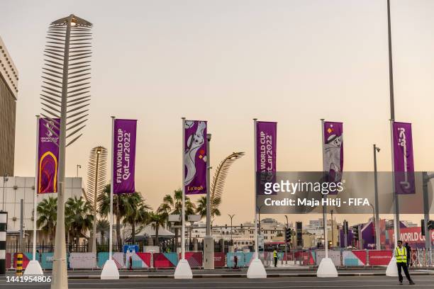Flags featuring Official Mascot La'eeb are seen on a street lights at Doha Corniche ahead of the FIFA World Cup Qatar 2022 at on November 16, 2022 in...