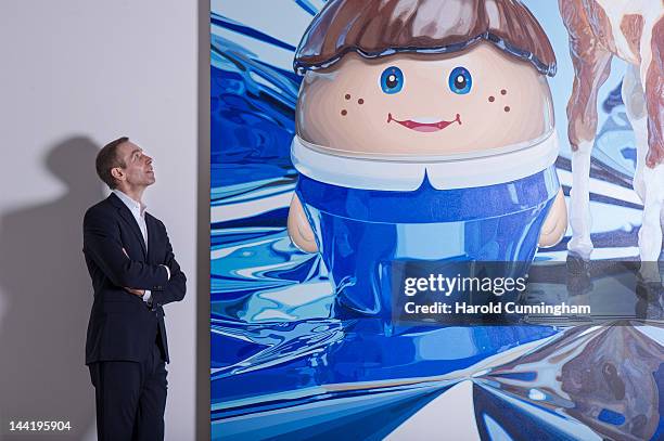 Artist Jeff Koons poses during the 'Jeff Koons' exhibition preview at the Fondation Beyeler on May 11, 2012 in Basel, Switzerland. The exhibition...