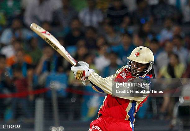 Royal Challengers Bangalore batsman Chris Gayle plays a shot during IPL T20 match played between Pune Warriors India vs Royal Challengers Bangalore...