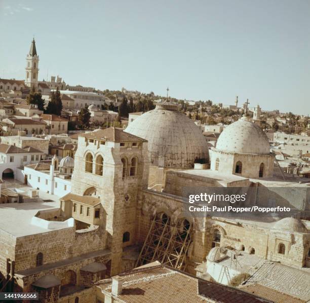 View of the bell tower, rotunda and Catholicon of the Church of the Holy Sepulchre in the Christian Quarter of the walled Old City of Jerusalem in...