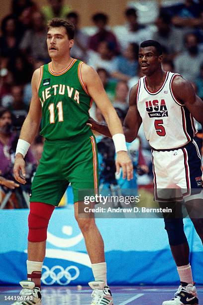Arvydas Sabonis of Lithuania stands against Arvydas Sabonis of the United States during the 1992 Olympics on August 6, 1992 at the Palau Municipal...
