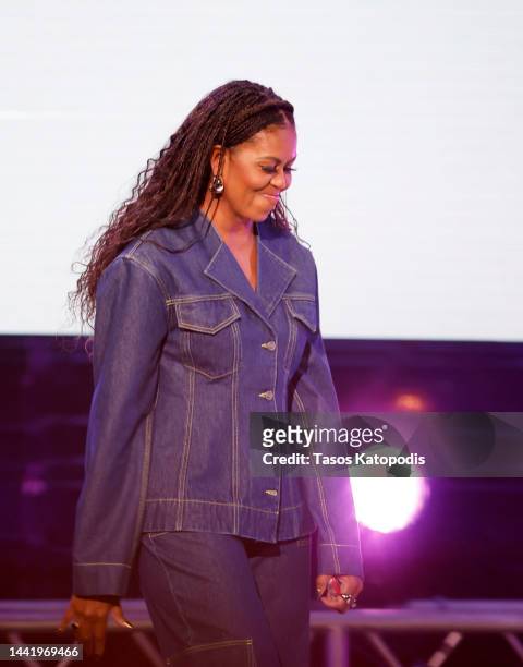 Former First Lady Michelle Obama walks onstage during the Michelle Obama: The Light We Carry Tour at Warner Theatre on November 15, 2022 in...