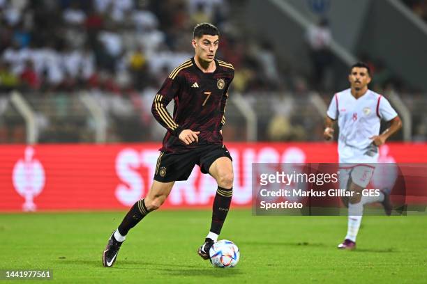 Kai Havertz of Germany runs with the ball during the international friendly match between Germany and Oman at Sultan Qaboos Sports Complex on...