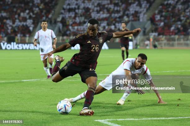 Youssoufa Moukoko of Germany battles for the ball with Juma Al-Habsi of Oman during the international friendly match between Germany and Oman at...
