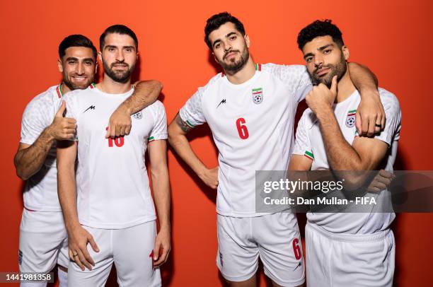 Alireza Jahanbakhsh, Karim Ansarifard, Saeid Ezatolahi and Mehdi Taremi of IR Iran pose during the official FIFA World Cup Qatar 2022 portrait...