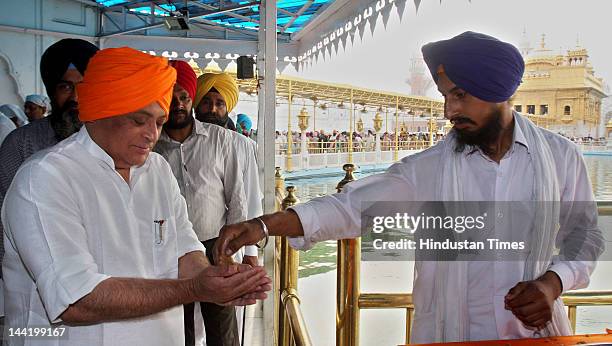 Union Rural Development Minister Jairam Ramesh takes prasad after paying obeisance at the Harmandar Sahib on May 11, 2012 in Amritsar, India. Rural...