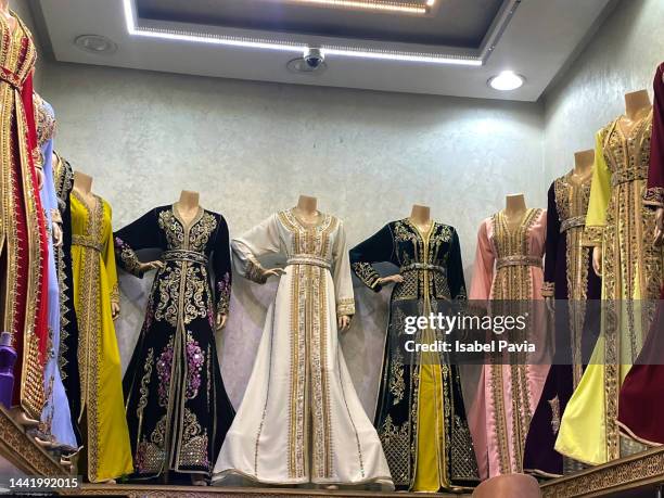 decorative moroccan djellabas on sale - medina district stock pictures, royalty-free photos & images