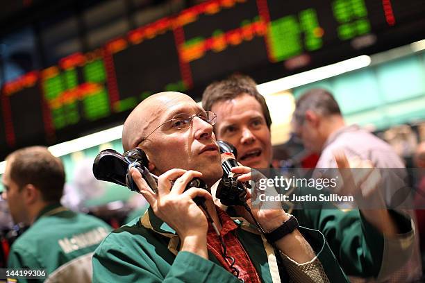 Oil traders work on the floor of the New York Mercantile Exchange on May 11, 2012 in New York City. The price of a barrel of oil slipped below $96...
