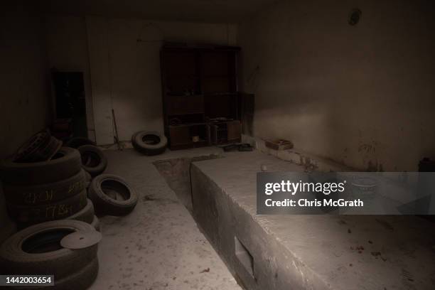 Garage filled with tyres is seen at a preliminary detention centre which is believed to have been used by Russian forces to jail and torture...