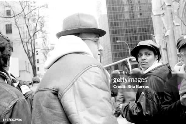 Close-up of American artist Keith Haring , with unidentified ACT UP demonstrator, during a protest in front of St Patrick's Cathedral, New York, New...