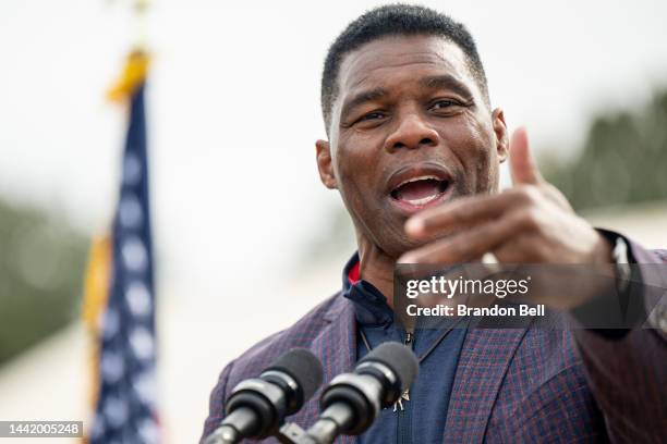 Republican U.S. Senate candidate Herschel Walker speaks to supporters at a campaign rally on November 16, 2022 in McDonough, Georgia. Walker, the...