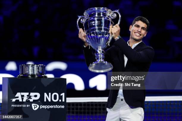 Carlos Alcaraz of Spain holds the ATP World Tour No. 1 trophy during day four of the Nitto ATP Finals at Pala Alpitour on November 16, 2022 in Turin,...