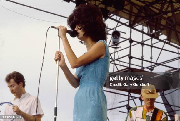 View of, from left, American New Wave musicians Fred Schneider , on tambourine, Cindy Wilson, and Ricky Wilson , all of the group the B-52's,...