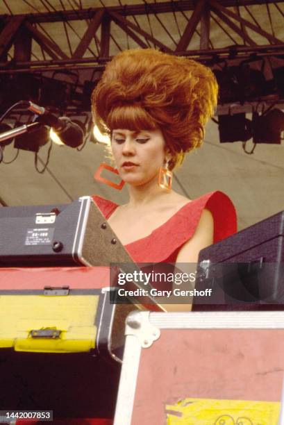 American New Wave musician Kate Pierson, of the group the B-52's, plays keyboards as she performs onstage during the Heatwave Festival at Mosport...