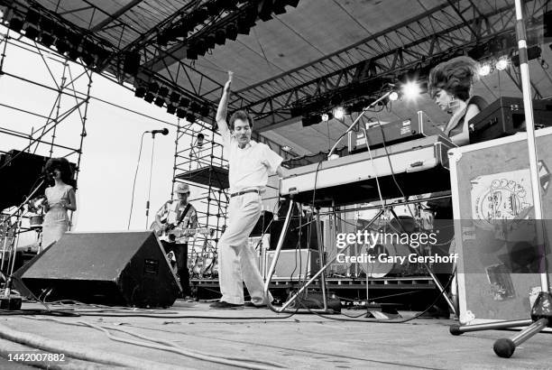 View of, from left, American New Wave musicians Cindy Wilson, Ricky Wilson , on guitar, Fred Schneider, and Kate Pierson, on keyboards, all of the...