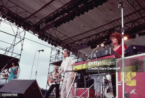 View of, from left, American New Wave musicians Cindy Wilson , Ricky Wilson , on guitar, Fred Schneider, and Kate Pierson, on keyboards, all of the...