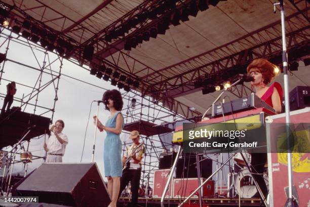 View of, from left, American New Wave musicians Fred Schneider, Cindy Wilson, Ricky Wilson , on guitar, and Kate Pierson, on keyboards, all of the...