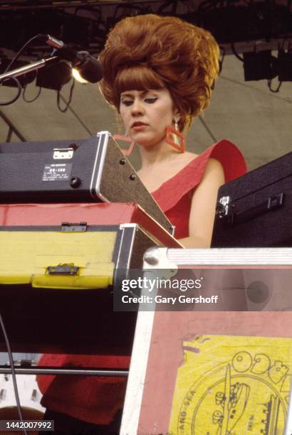 American New Wave musician Kate Pierson, of the group the B-52's, plays keyboards as she performs onstage during the Heatwave Festival at Mosport...