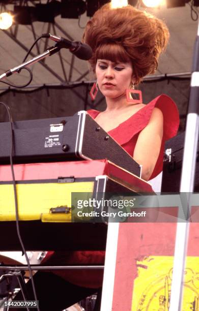 American New Wave musician Kate Pierson, of the group the B-52's, plays keyboards as she performs onstage during the Heatwave Festival at Mosport...