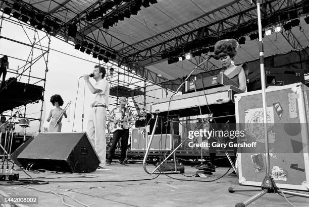 View of, from left, American New Wave musicians Cindy Wilson, Fred Schneider, Ricky Wilson , and Kate Pierson, on keyboards, all of the group the...