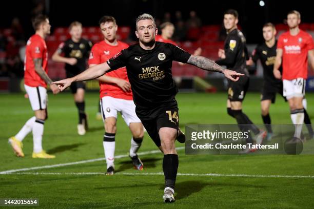 Jack Marriott of Peterborough United celebrates after scoring their sides second goal during the Emirates FA Cup First Round Replay match between...
