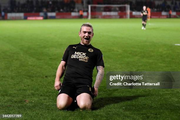 Jack Marriott of Peterborough United celebrates after scoring their sides third goal during the Emirates FA Cup First Round Replay match between...