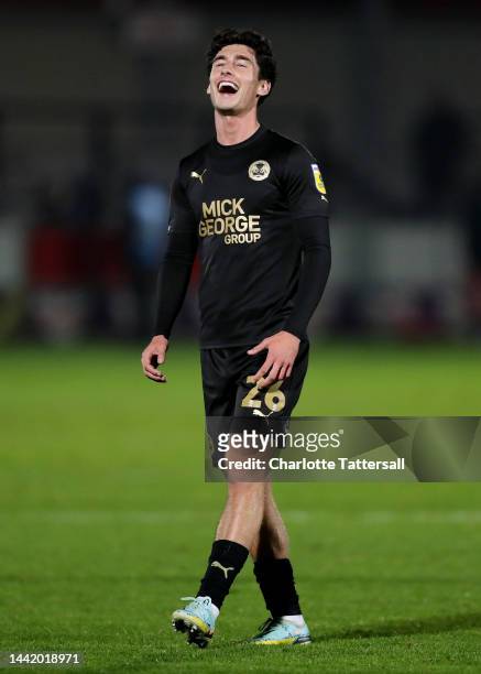 Joel Randall of Peterborough United celebrates following their sides victory after the Emirates FA Cup First Round Replay match between Salford City...