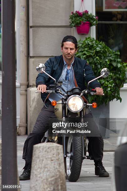 Actor Bradley Cooper is sighted riding a 'Triumph' motorbike on May 11, 2012 in Paris, France.
