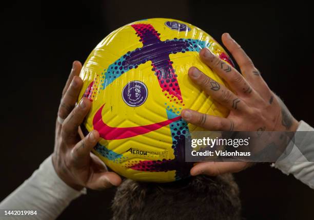 The official Premier League 2022/23 winter Nike match ball in the hands of a player during the Premier League match between Wolverhampton Wanderers...