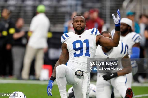 Defensive end Yannick Ngakoue of the Indianapolis Colts stretches before a game against the Las Vegas Raiders at Allegiant Stadium on November 13,...