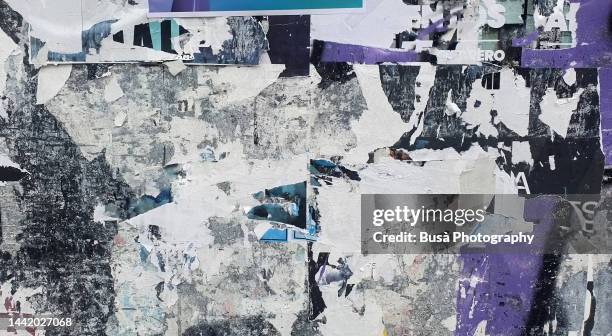 scratched layers of posters and placards on a street wall - punk rock poster stock pictures, royalty-free photos & images