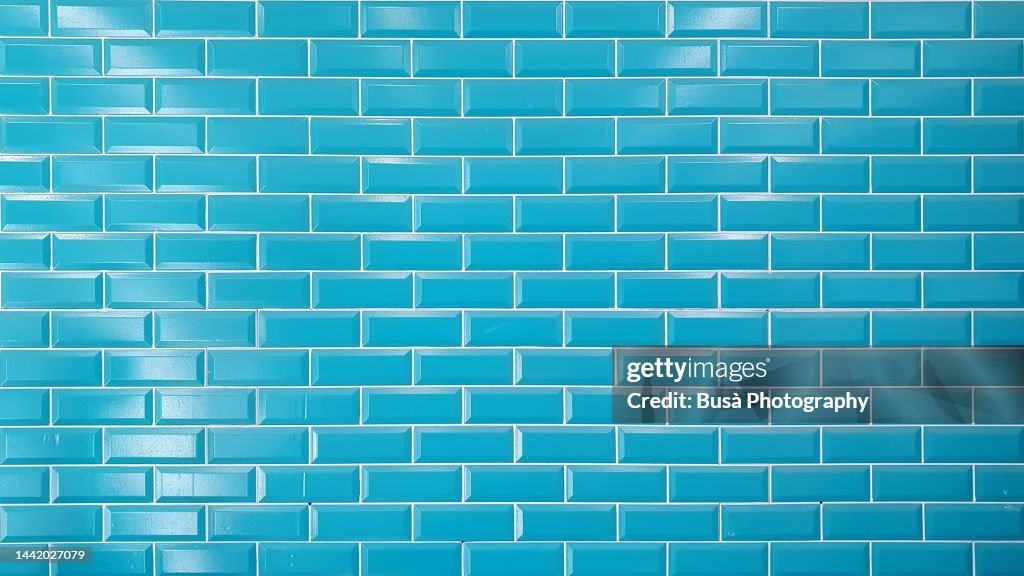 Bright blue brick tiled wall