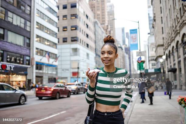 junge frau in bewegung - beautiful woman on the street of new york city stock-fotos und bilder