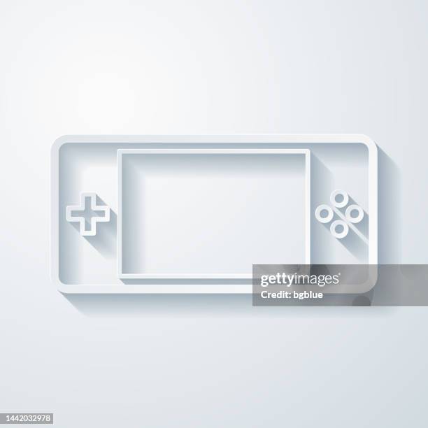 handheld game console. icon with paper cut effect on blank background - console controller isolated stock illustrations