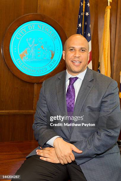 Newark Mayor Cory Booker recieves 200 cribs from CEO of Delta Children's Products Joseph Shamie to distribute during the 2012 Newark Now event on May...