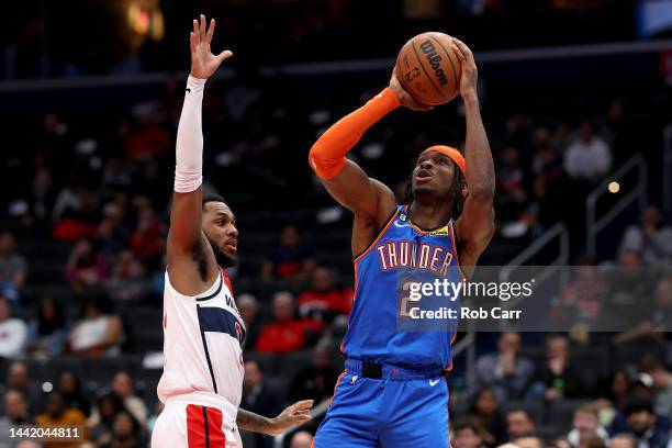 Shai Gilgeous-Alexander of the Oklahoma City Thunder puts up a shot in front of Monte Morris of the Washington Wizards in the first half at Capital...