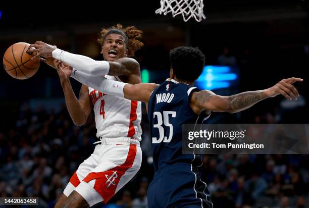 Jalen Green of the Houston Rockets draws the foul from Christian Wood of the Dallas Mavericks in the first quarter at American Airlines Center on...