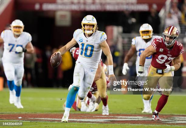 Justin Herbert of the Los Angeles Chargers scrambles up field with the ball during the second quarter against the San Francisco 49ers at Levi's...