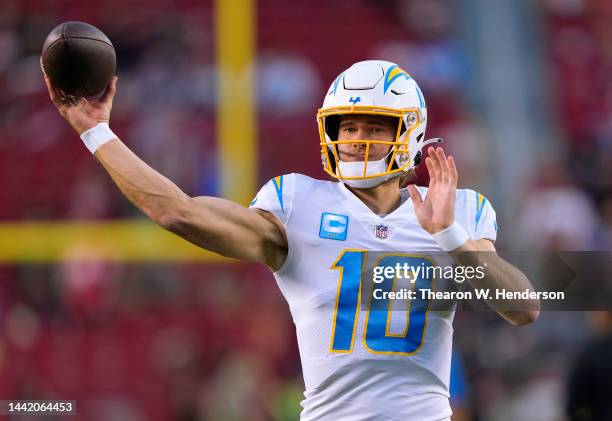 Justin Herbert of the Los Angeles Chargers warms up during pregame warm ups prior to playing the San Francisco 49ers in an NFL football game at...