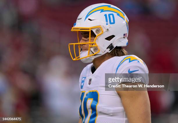 Justin Herbert of the Los Angeles Chargers looks on during pregame warm ups prior to playing the San Francisco 49ers in an NFL football game at...