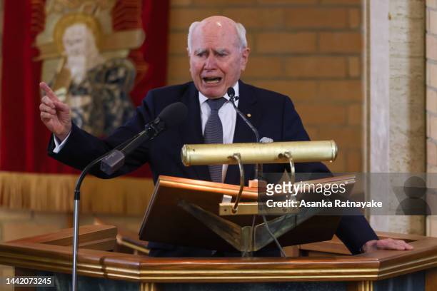 Former Australian Prime Minister John Howard delivers a tribute during the state memorial service of Peter Reith on November 17, 2022 in Melbourne,...