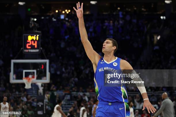 Brook Lopez of the Milwaukee Bucks reacts to a three point shot during the second half of a game against the Cleveland Cavaliers at Fiserv Forum on...