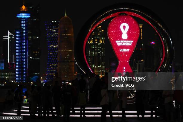 People view FIFA World Cup Qatar 2022 countdown trophy clock at night on November 16, 2022 in Doha, Qatar.