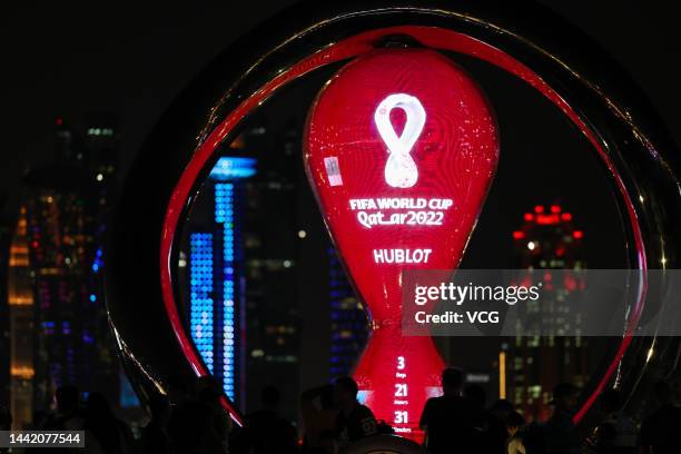 People view FIFA World Cup Qatar 2022 countdown trophy clock at night on November 16, 2022 in Doha, Qatar.