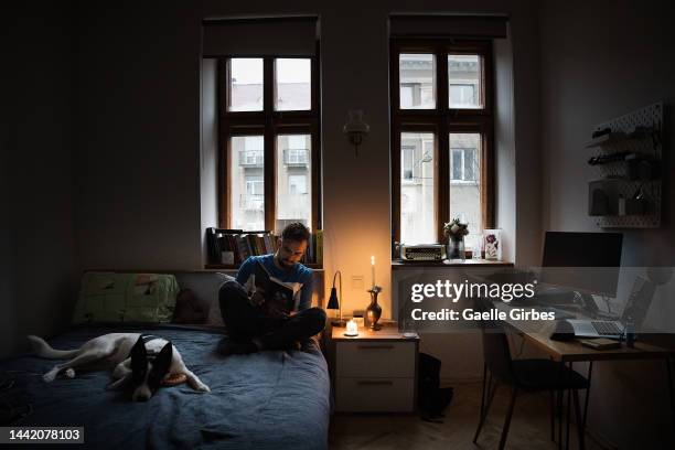 During power outages, Petro, who works in the IT field, can't work without the internet, so he waits for the power to come back while reading a book...