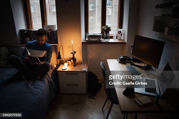 During power outages, Petro, who works in the IT field, can't work without the internet, so he waits for the power to come back while reading a book...