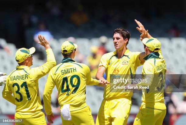 Patrick Cummins of Australia celebrates with team mates the wicket of James Vince of England for 5 runs caught Alex Carey of Australia during game...