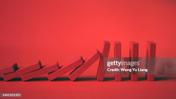 domino effect concept , economy recession crashing concept photo - dominoeffekt stock-fotos und bilder